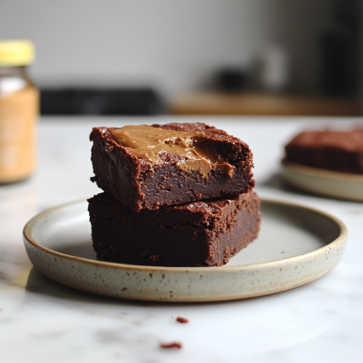 Close-up side view of fudgy protein brownies on plate