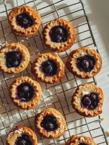 golden baked blueberry pie cookies cooling on rack