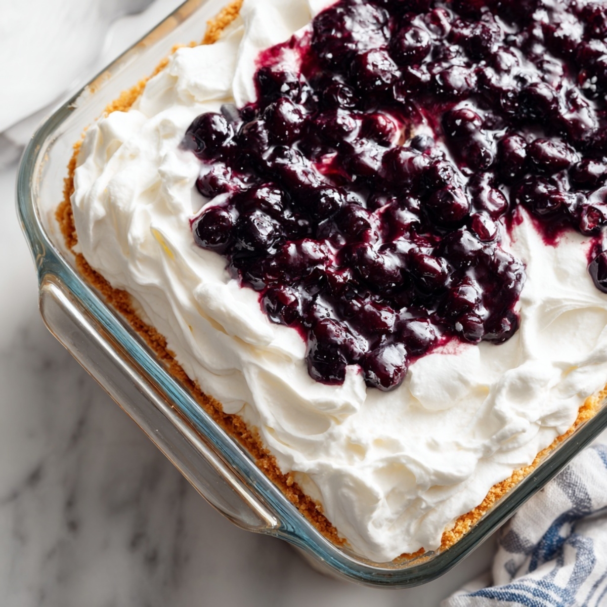Final layered Blueberry Delight dessert with Cool Whip topping