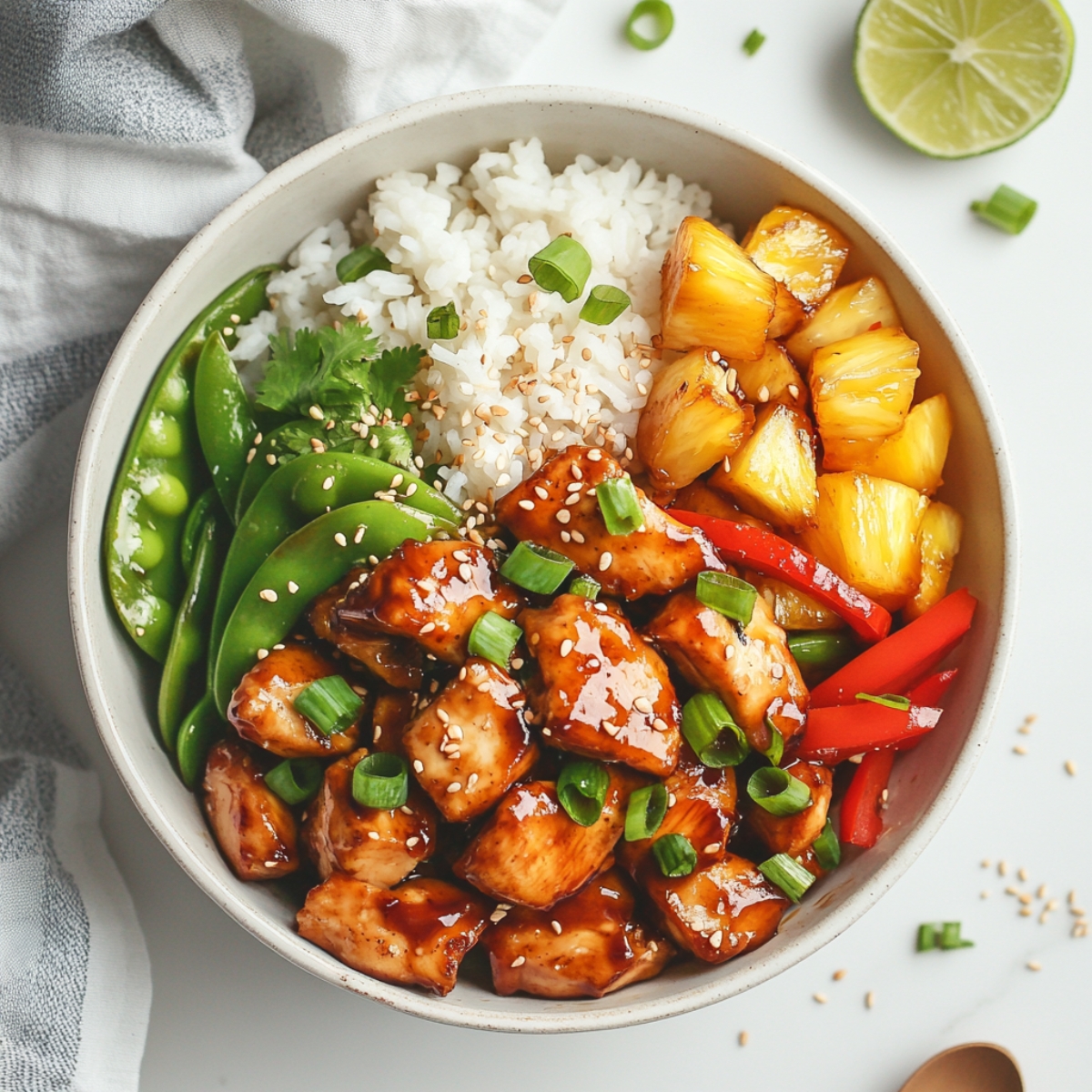 top-down view of chicken teriyaki pineapple bowl with rice and pineapple
