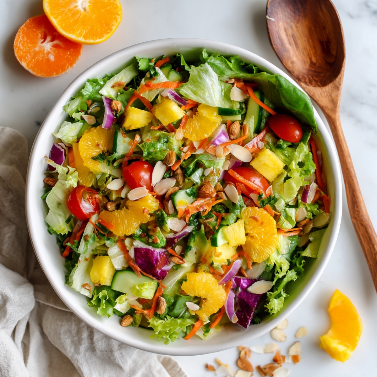 Finished sunshine salad in white bowl on kitchen counter

