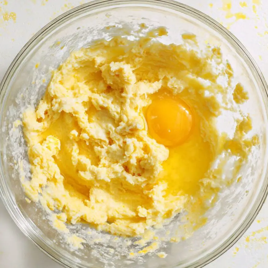 Mashing bananas and mixing wet ingredients for cake batter