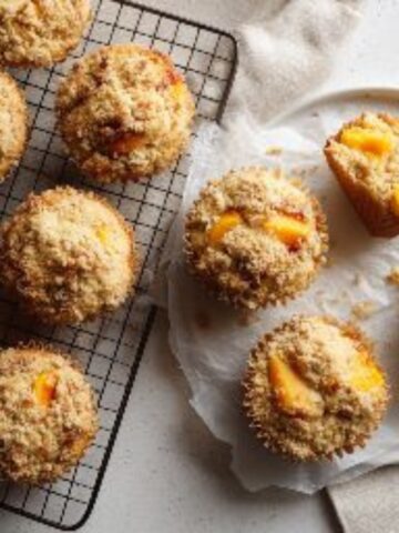fresh peach muffins ingredients laid out on white counter