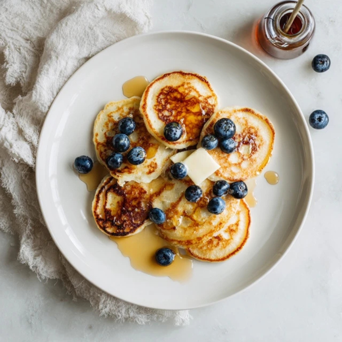 mini pancakes on a white plate