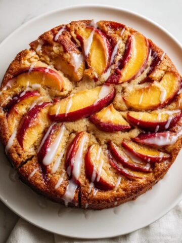 Moist homemade nectarine cake with golden crust and fresh fruit slices