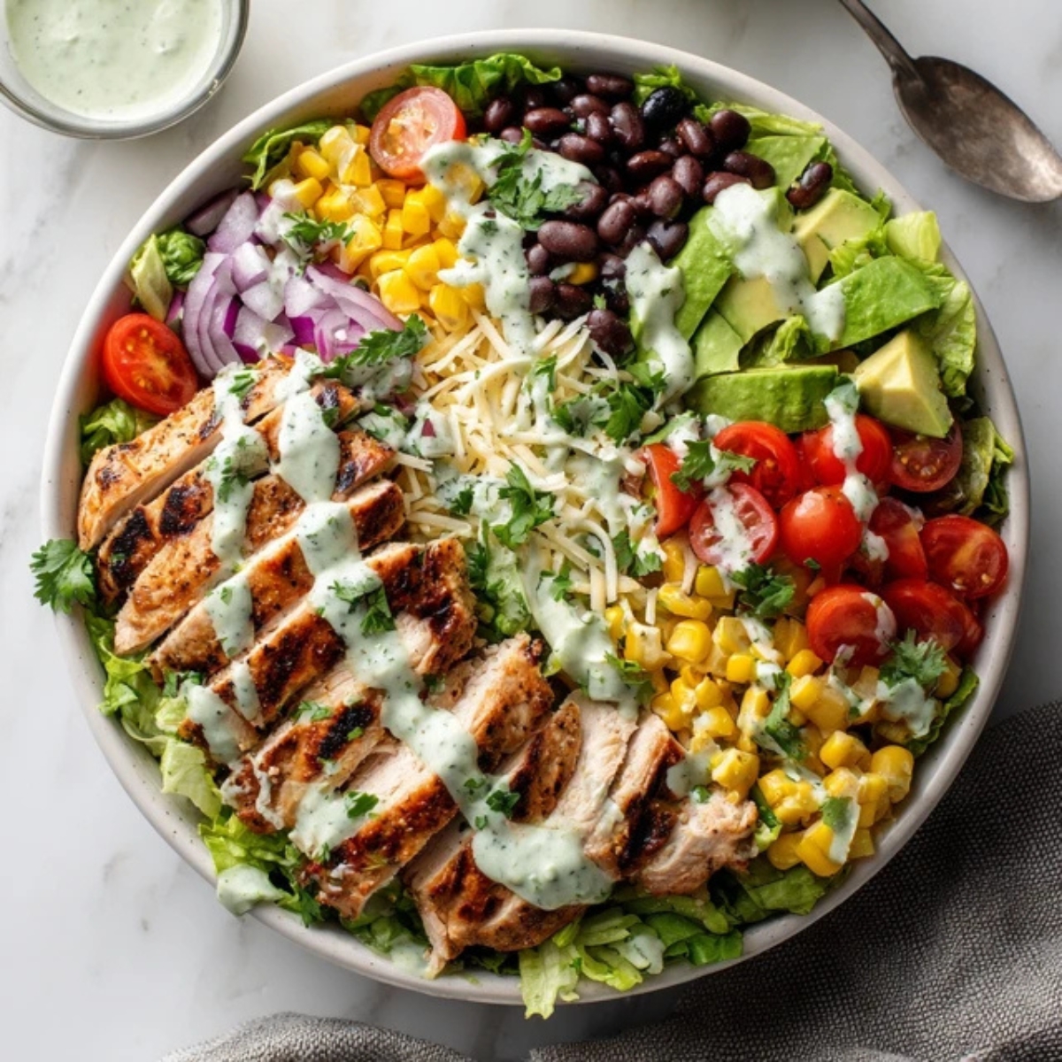 hearty bowl of southwest chicken salad with fresh toppings

