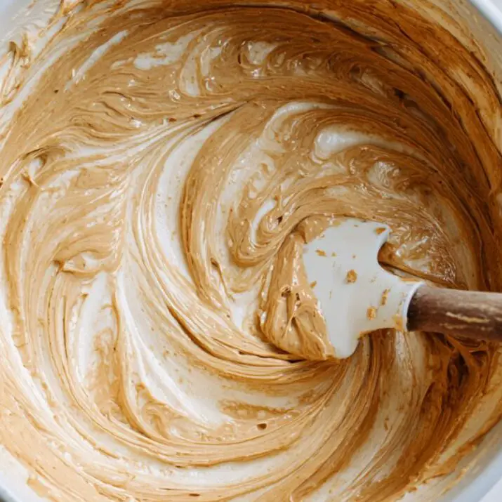 Close-up of creamy Biscoff filling being prepared on a kitchen counter

