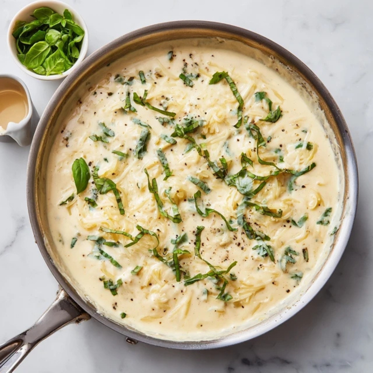 creamy garlic parmesan sauce in skillet for tortellini