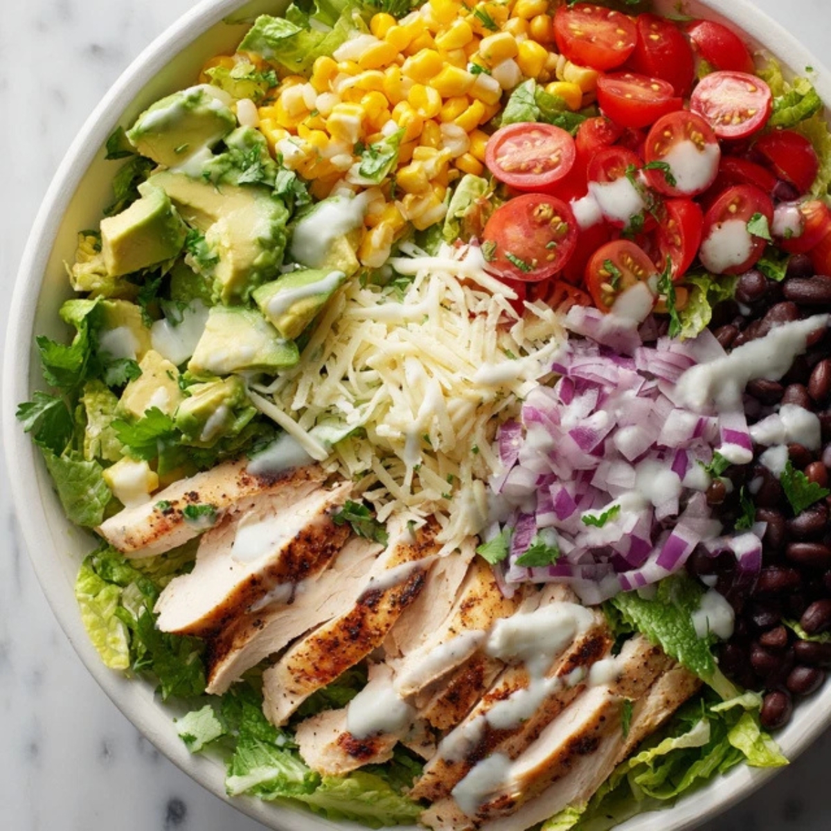 assembled southwest chicken salad in white bowl