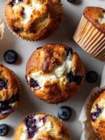 Homemade blueberry cream cheese muffins with creamy swirl