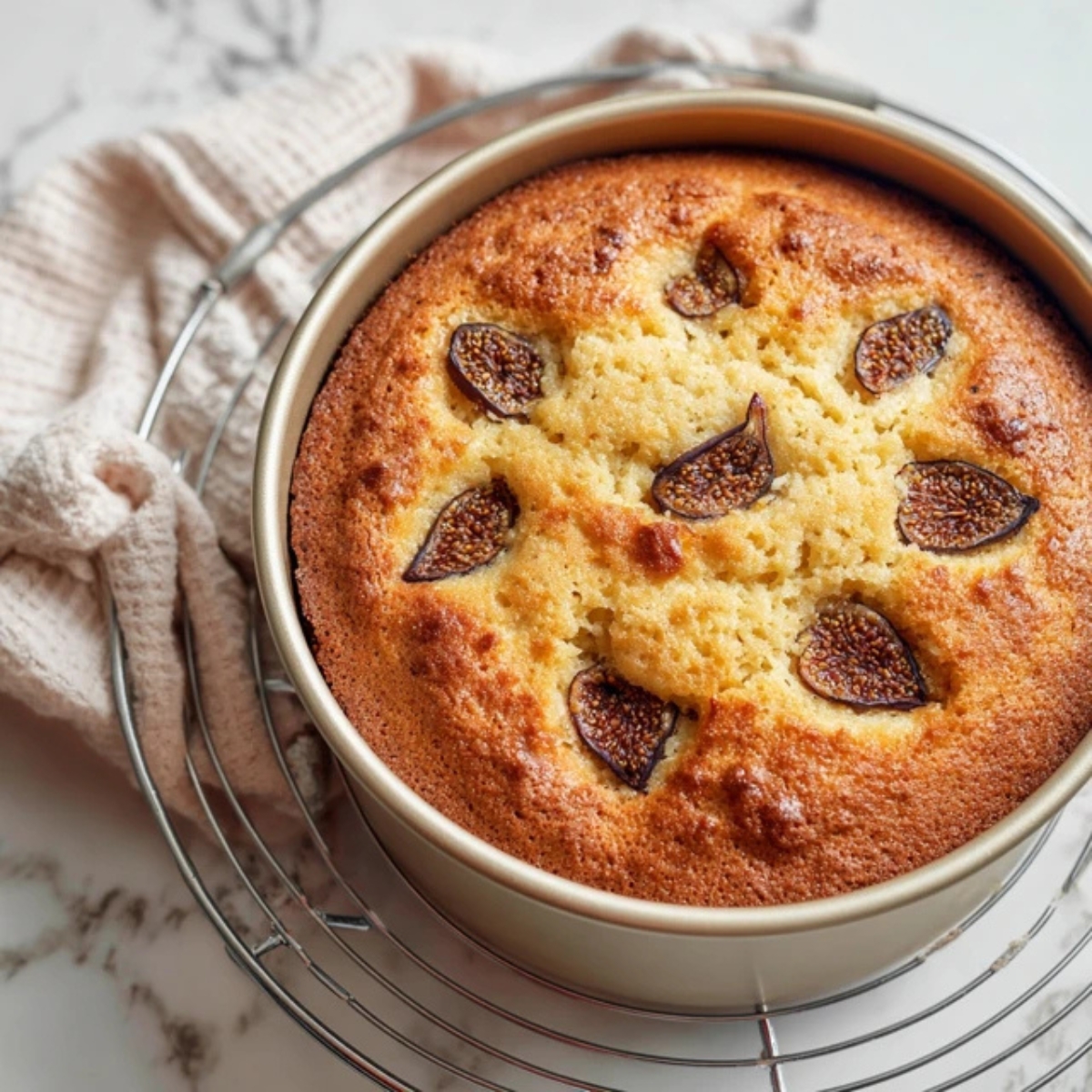 closeup baked fig cake cooling on rack