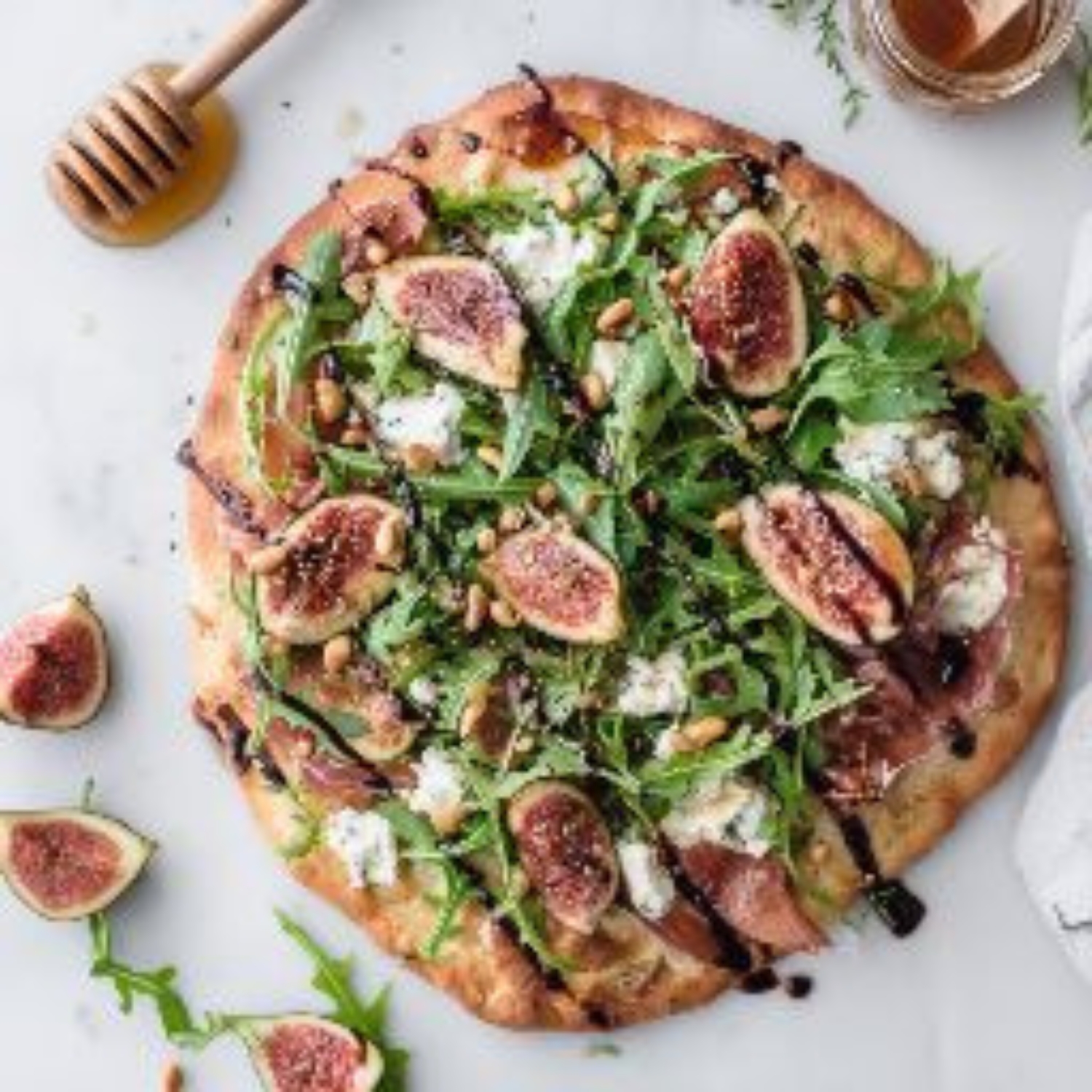 fig prosciutto flatbread with arugula and balsamic glaze