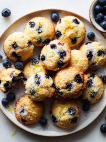 Freshly baked lemon blueberry cookies on a white kitchen counter