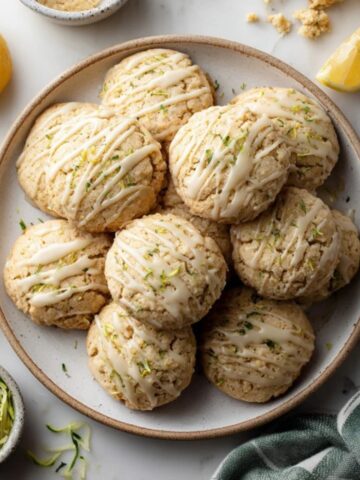 plate of homemade lemon zucchini cookies with glaze