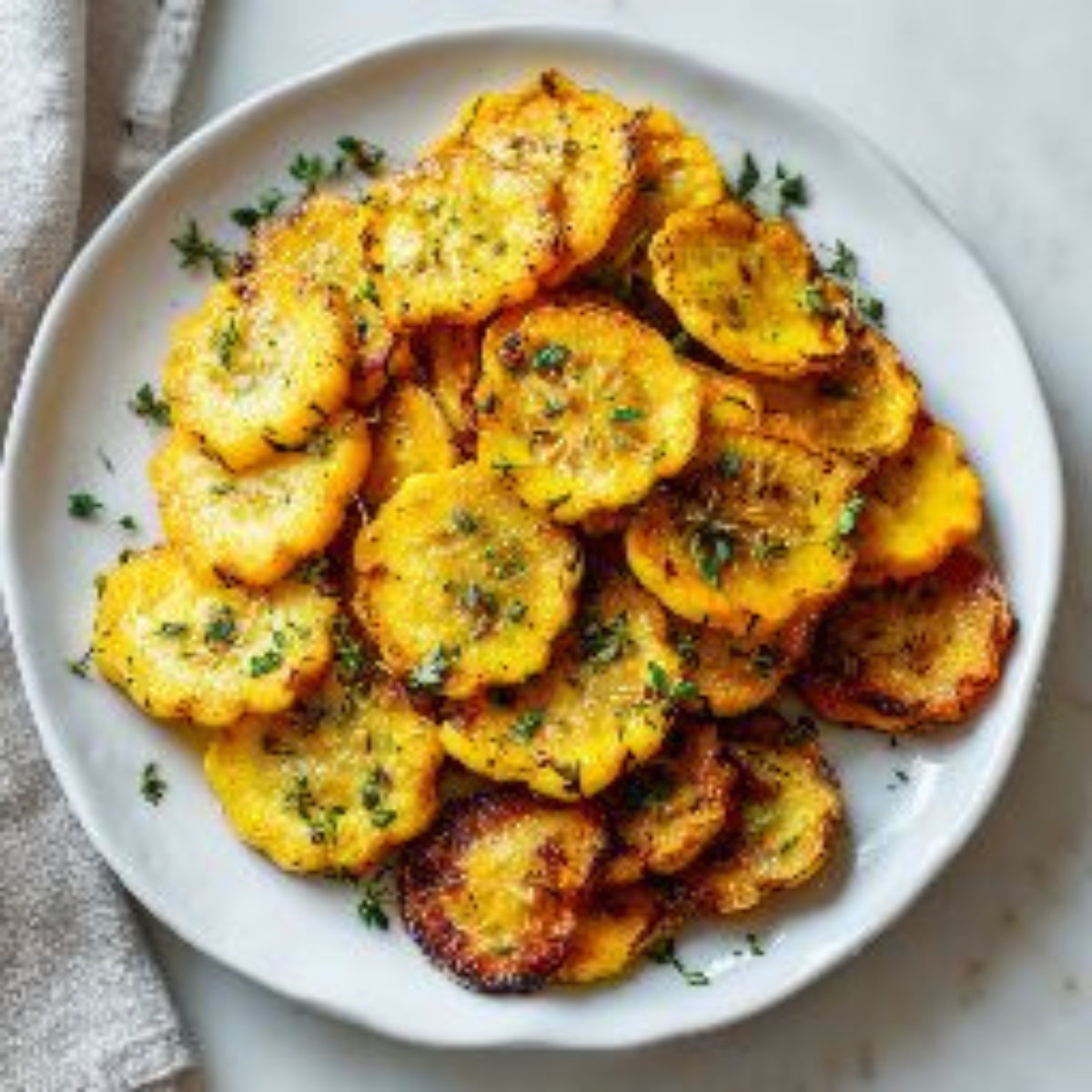 plate of roasted yellow squash with golden edges