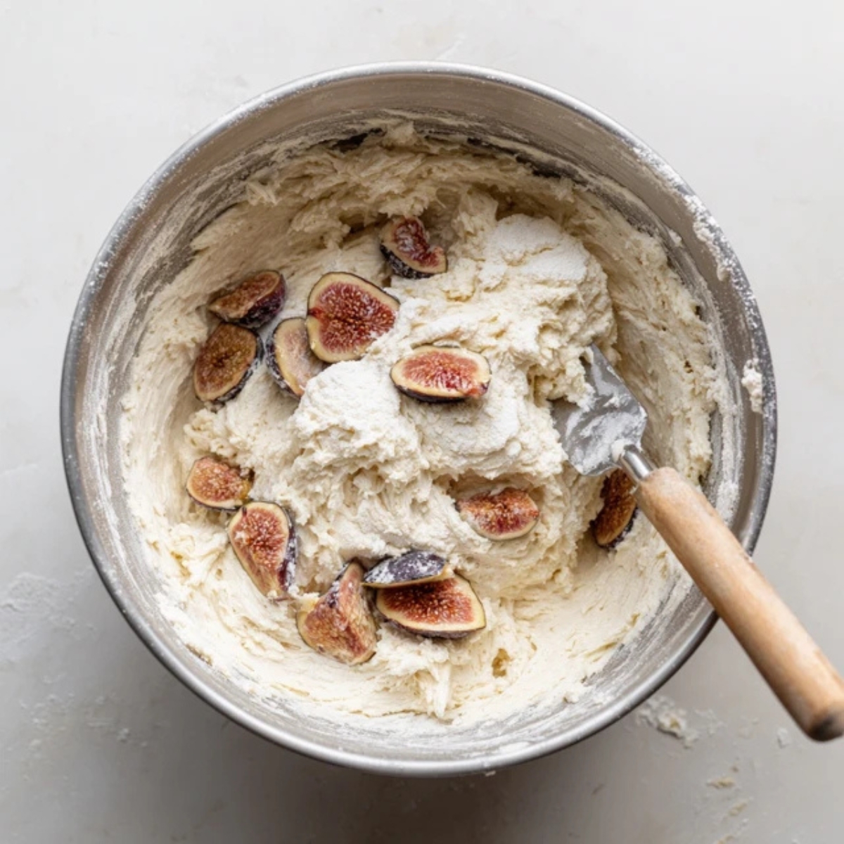 fig cupcake batter with fresh figs folded in