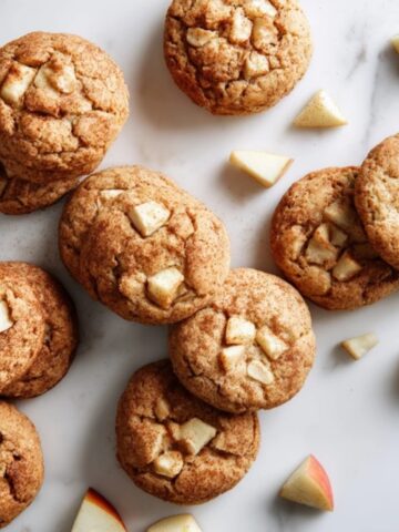 Homemade apple cinnamon cookies on white kitchen counter