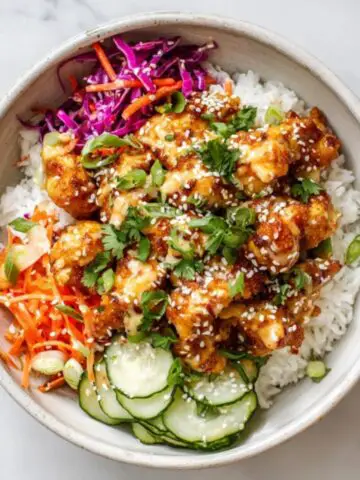 bang bang chicken bowl with crispy chicken rice and vegetables