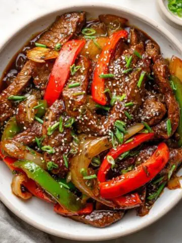 Homemade black pepper steak stir fry with peppers and onions