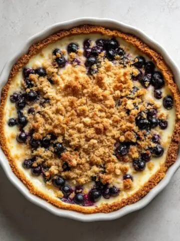 blueberry crumble cheesecake with golden oat topping