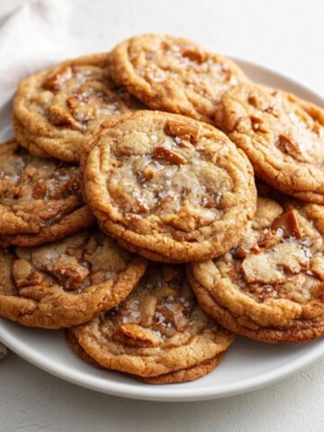 Homemade chewy toffee cookies with golden edges and toffee bits