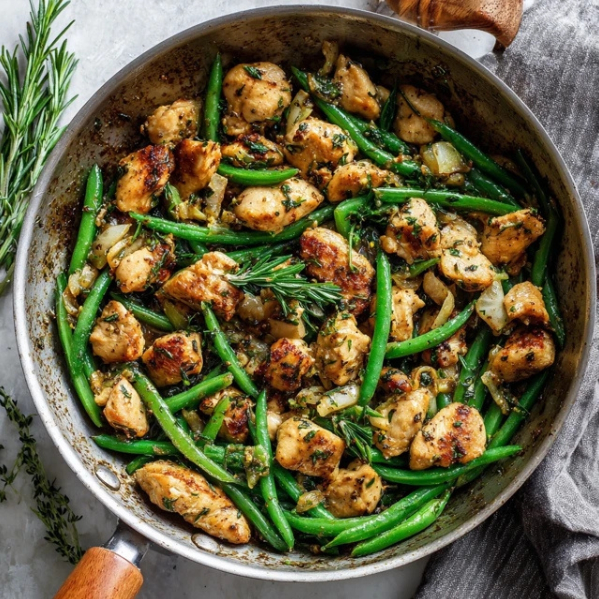 Healthy chicken and green beans skillet dinner on white counter