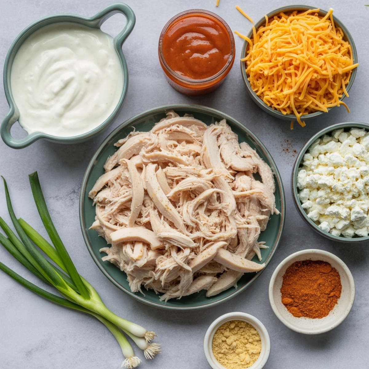 healthy buffalo chicken dip ingredients laid out on kitchen counter