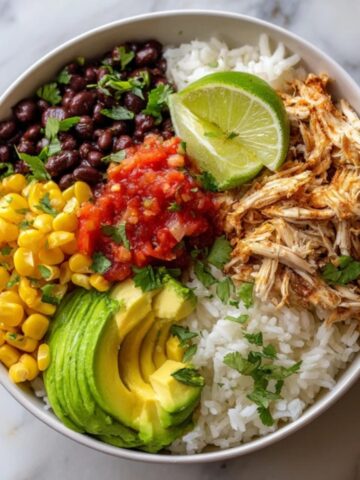Homemade Instant Pot burrito bowl with chicken, rice, beans, and toppings