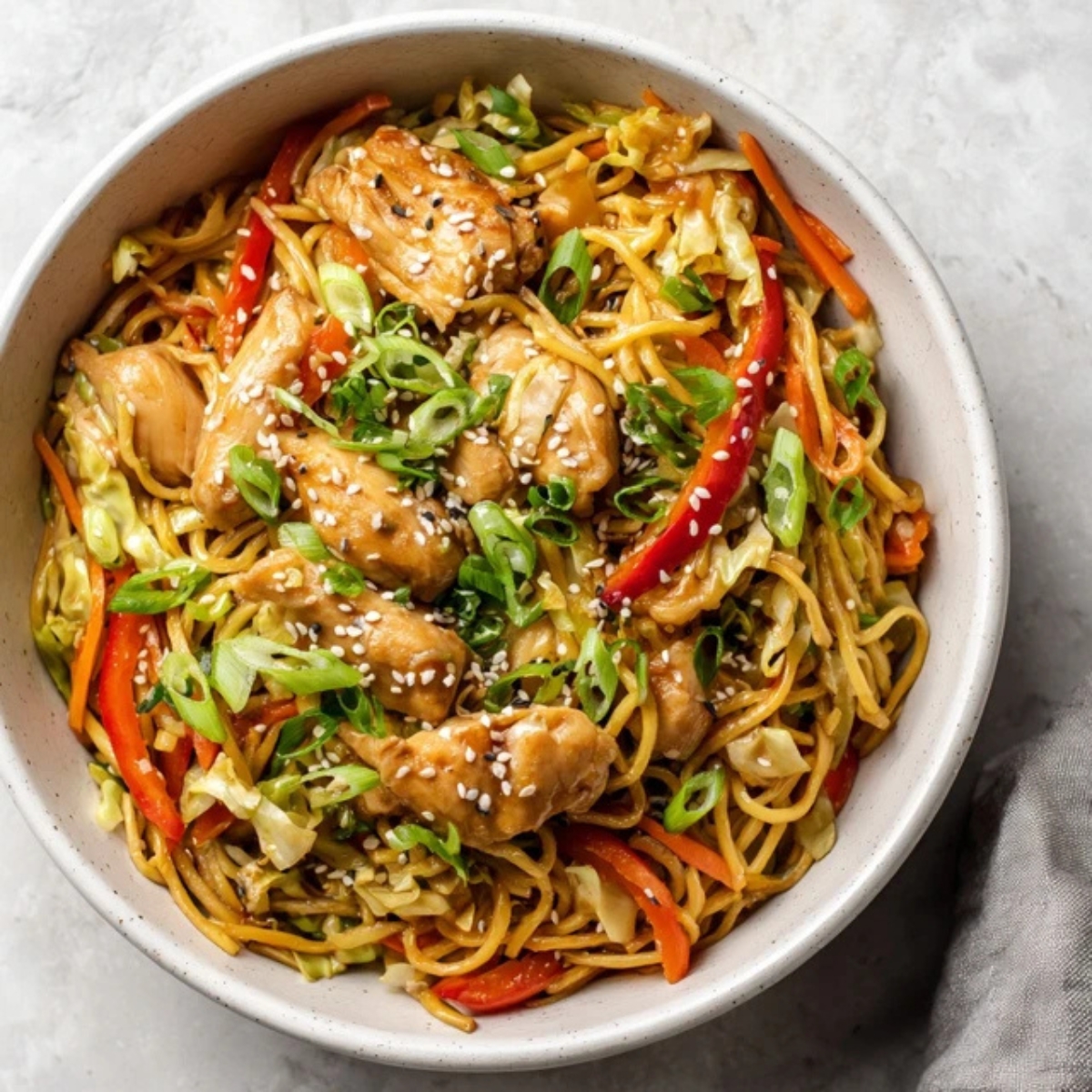 Instant Pot chicken yakisoba with noodles, chicken, and vegetables in a bowl