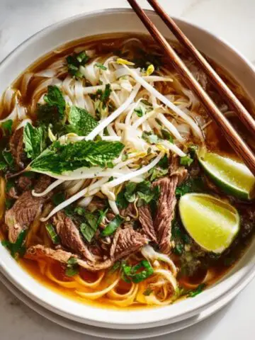 Instant Pot Pho with noodles, beef, herbs, and lime