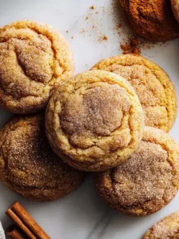soft chewy pumpkin spice sugar cookies on white counter
