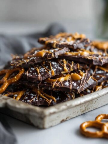 Salted caramel pretzel bark with chocolate, caramel drizzle, and pretzels