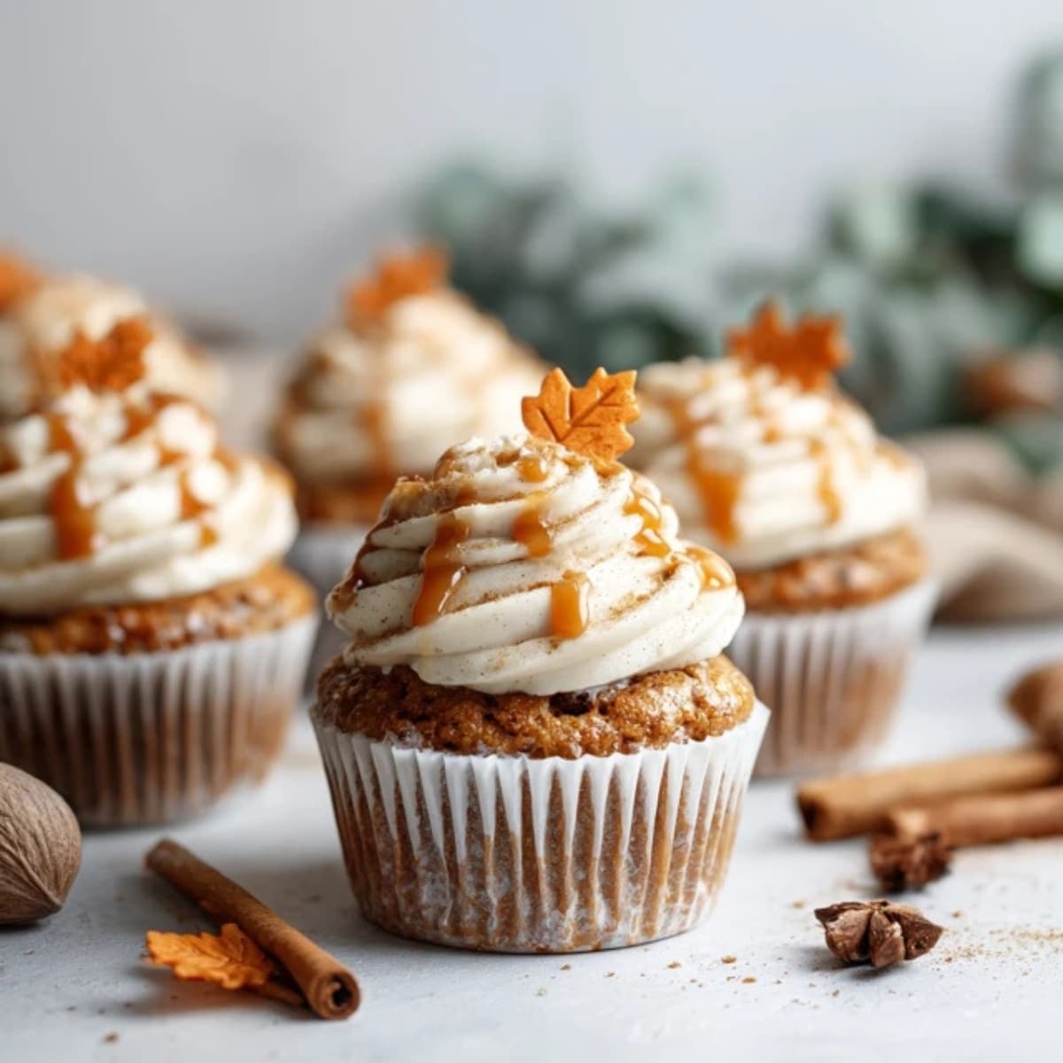 cozy fall cupcakes with cinnamon frosting and caramel drizzle