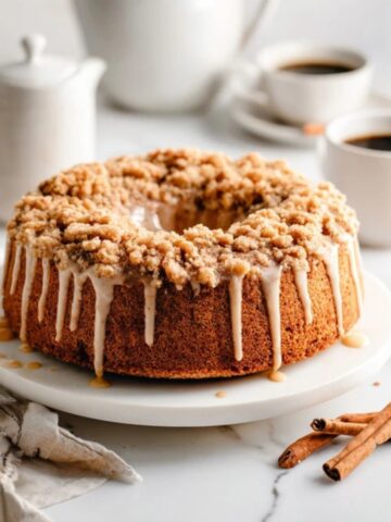 gluten free pumpkin coffee cake with crumb topping on white kitchen counter