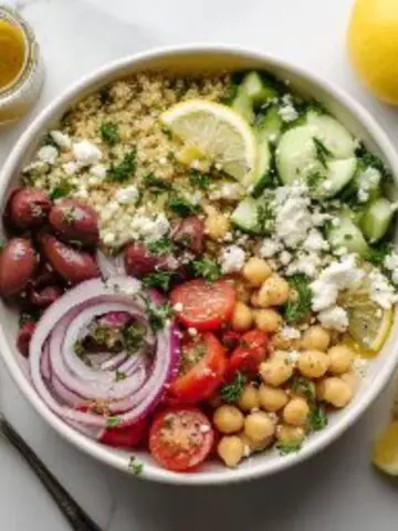 vibrant greek quinoa bowl with feta and lemon vinaigrette