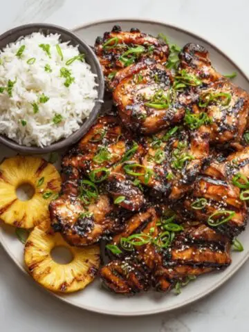 Hawaiian Huli Huli Chicken with pineapple and rice on white kitchen counter