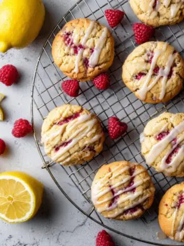 Homemade lemon raspberry cookies with fresh glaze on white kitchen counter