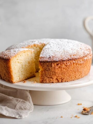 Light and fluffy homemade sponge cake on white kitchen counter