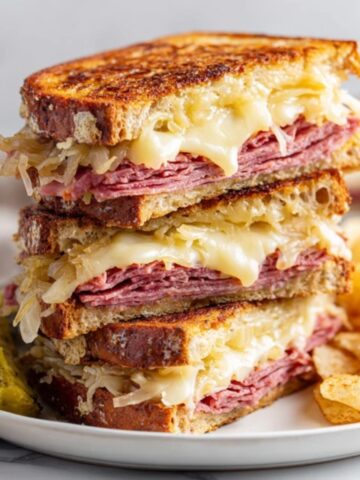 Homemade Reuben Sandwich with melted Swiss cheese and sauerkraut on rye bread