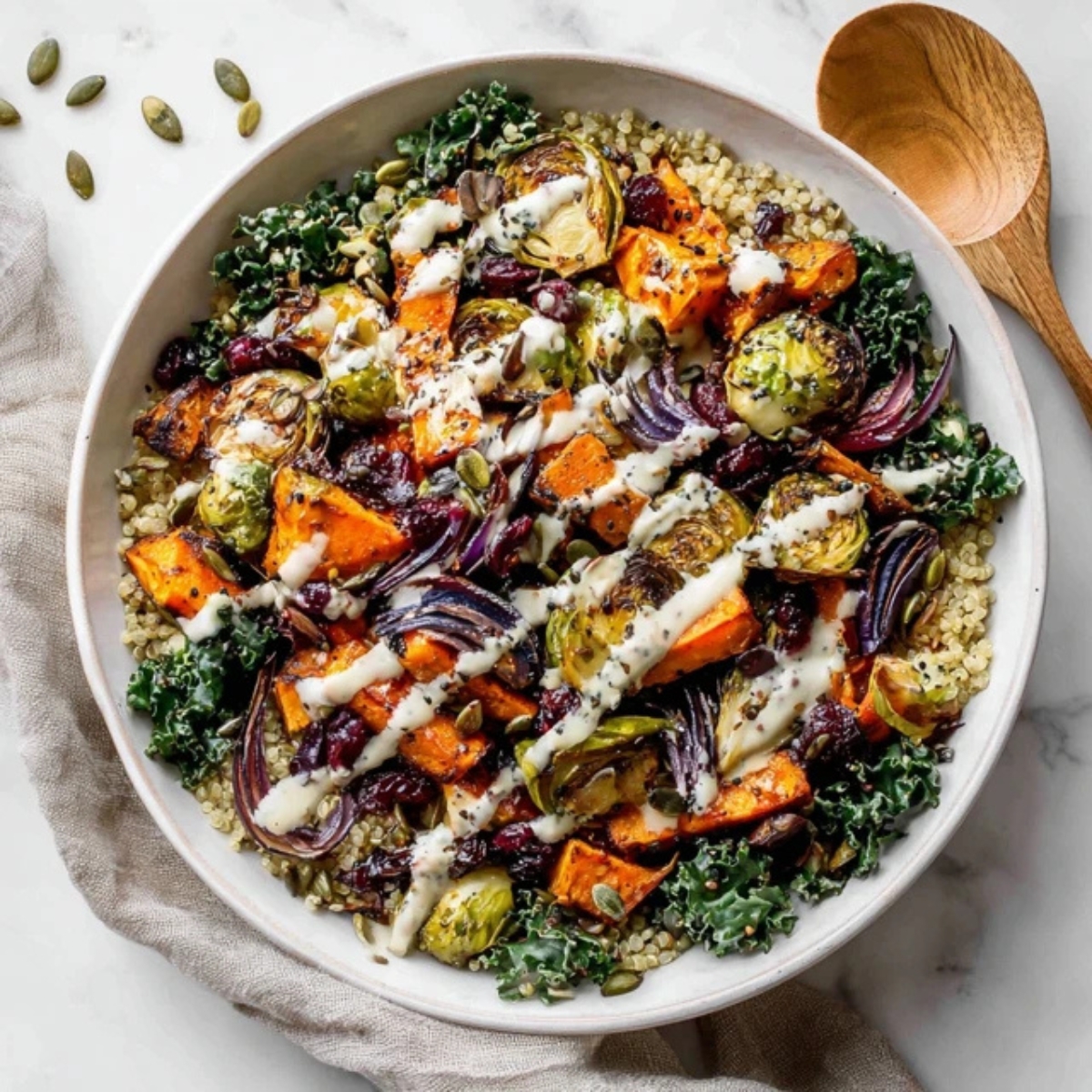 Winter Harvest Dinner Bowl with roasted vegetables, quinoa, and maple tahini dressing