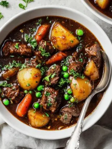 Hearty homemade beef stew with tender beef, carrots, and potatoes in rich gravy