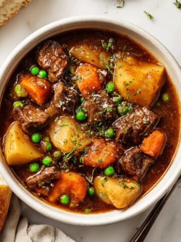 Hearty Instant Pot beef stew with tender beef, carrots, and potatoes in rich gravy