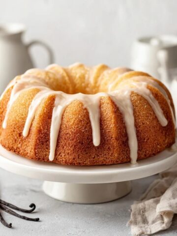 Moist Vanilla Bundt Cake with vanilla glaze on white kitchen counter